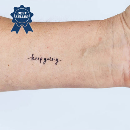 'keep going' tattoo on an arm with a 'Best Seller' badge above it - MotivInk