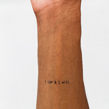 'I can & I will' empowering temporary tattoo on inner forearm, plain white background.