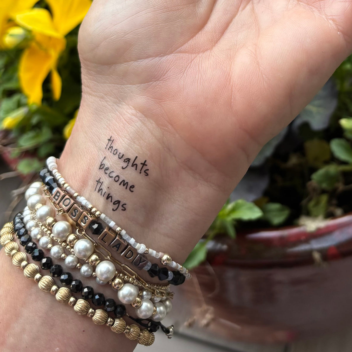 thoughts become things tattoo on wrist