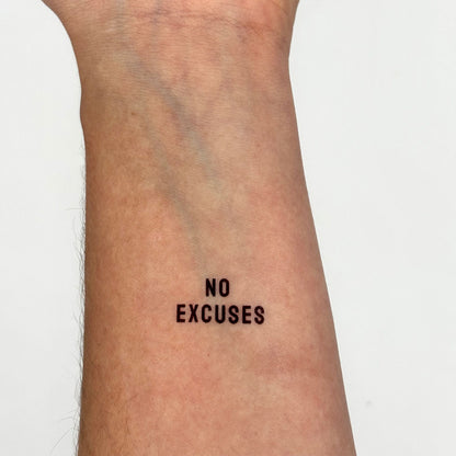 'no excuses' black ink tattoo on forearm – bold, empowering temporary quote for focus and discipline